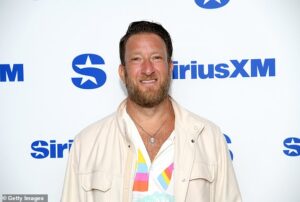 Dave Portnoy filming a pizza review outside Boardtown Pizza & Pints in Starkville during Mississippi State’s football weekend.