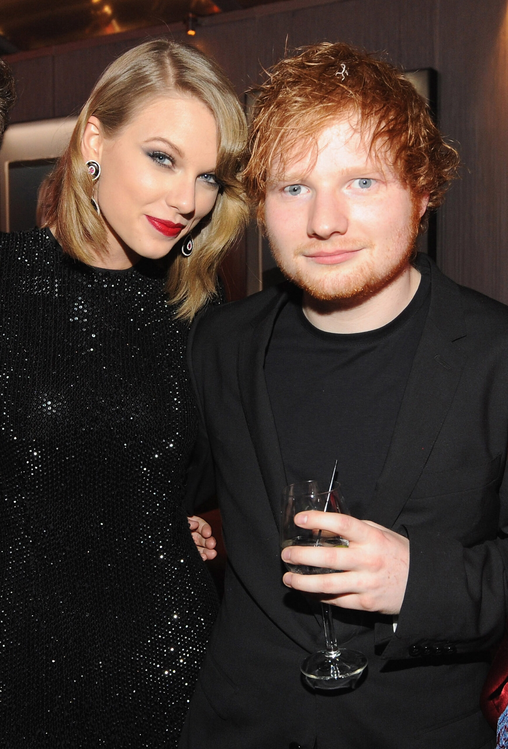Taylor Swift and Ed Sheeran posing together at the 2014 Vanity Fair Oscar Party.
