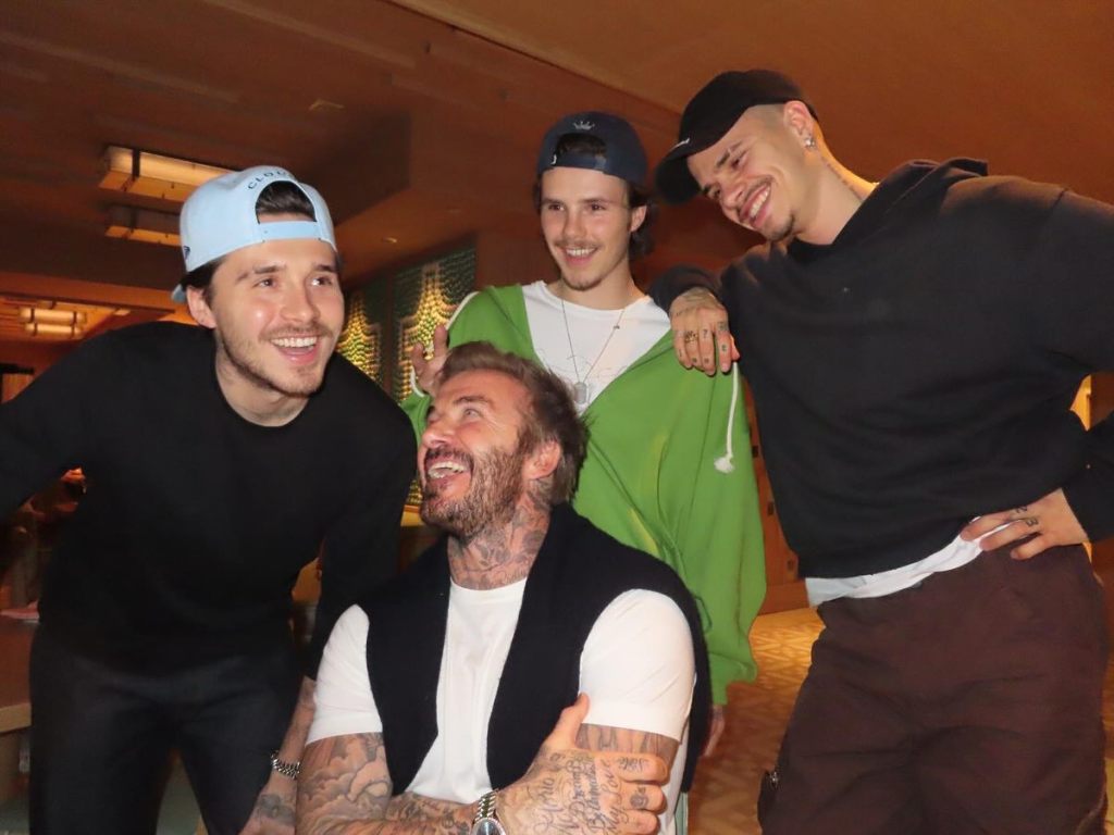 David Beckham with sons Brooklyn, Romeo and Cruz; he later joked he 'ruined' the duet.