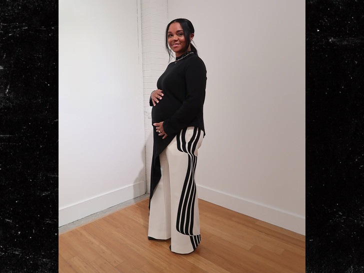 Virginia Williams at a gallery with her hand-painted ceramic piece, revealing her baby bump — “2nd masterpiece on the way… God is good.”