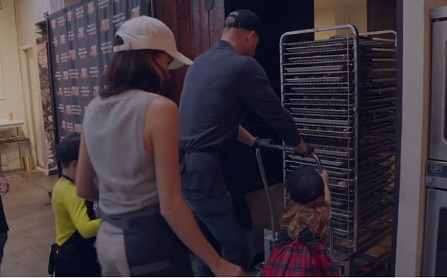 Archie and Lilibet push a food donation trolley in the Sussexes' holiday video