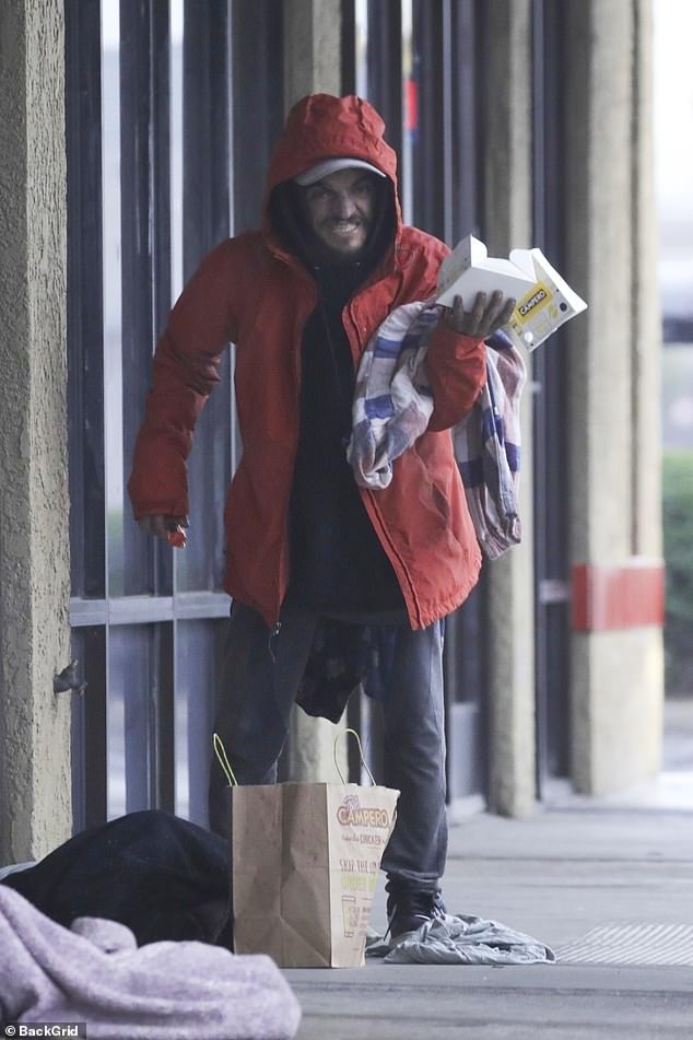 Tylor Chase outdoors in Riverside during a rainy Christmas week, before hospitalization