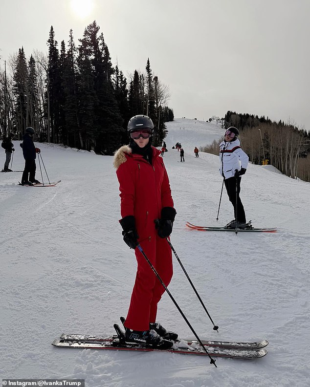 Ivanka Trump in a bright red ski suit posing with skis on the mountain; her sons wore matching red ski pants in another snap