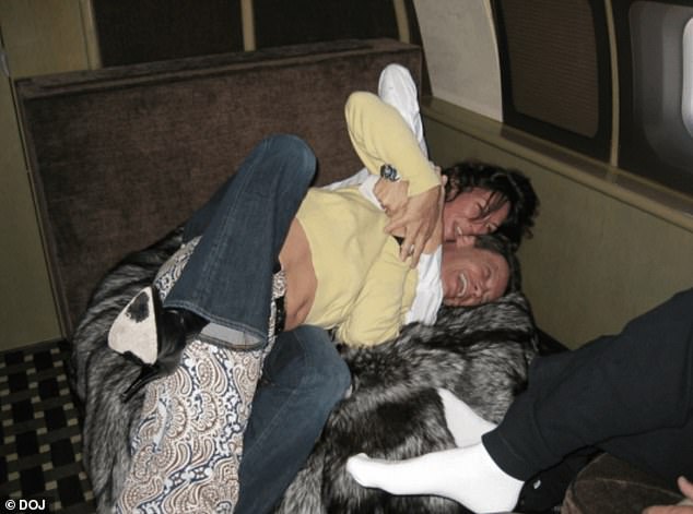 Ghislaine Maxwell play-fighting on a sofa with Jean-Luc Brunel in an undated photo included in the newly released files.