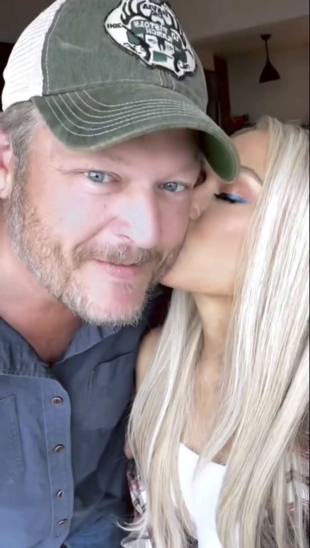 Gwen Stefani kissing Blake Shelton on the cheek in an Instagram photo.