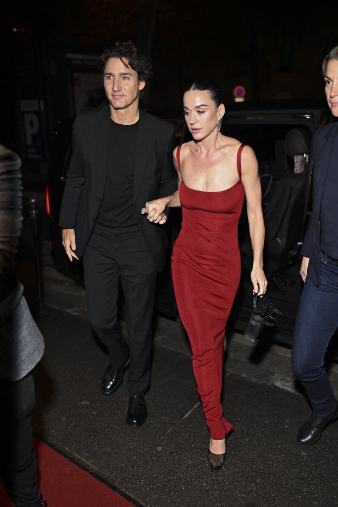 Katy Perry and Justin Trudeau walking hand-in-hand while arriving for her 41st birthday celebration in Paris.