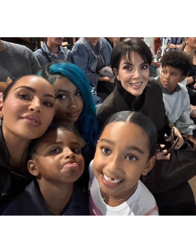 Kim Kardashian takes a selfie with Kris Jenner and family members.