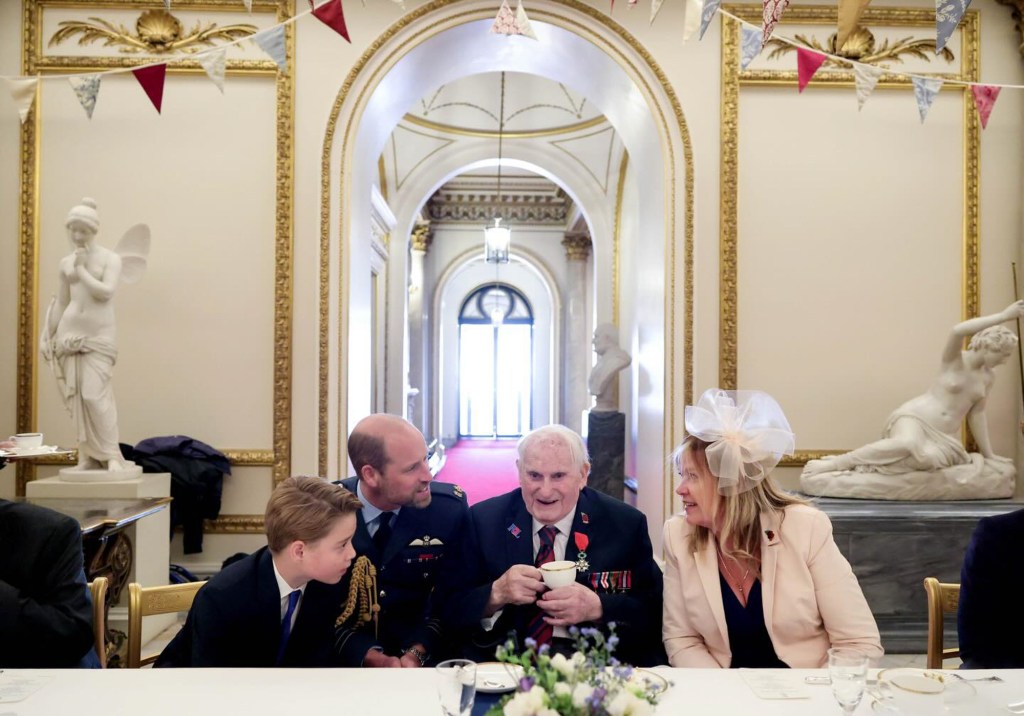 Prince William and Prince George speaking with a veteran during the 80th anniversary of VE Day.