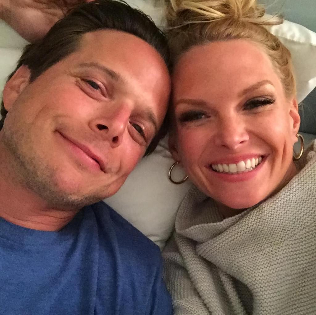 Kelley and Scott Wolf smiling together in an Instagram photo.