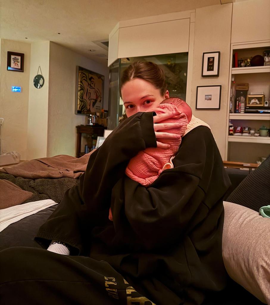 Close-up of Pete Davidson holding baby Scottie; the couple welcomed her on December 12.