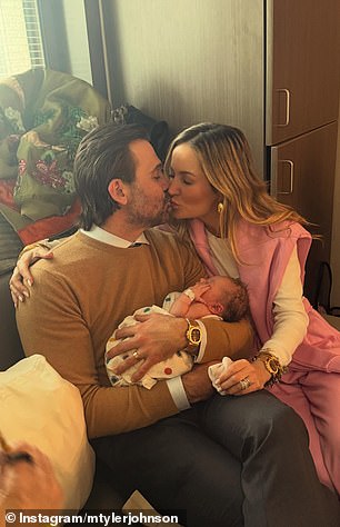 Emily Maynard and husband Tyler Johnson holding their new grandchild in a joint Instagram post