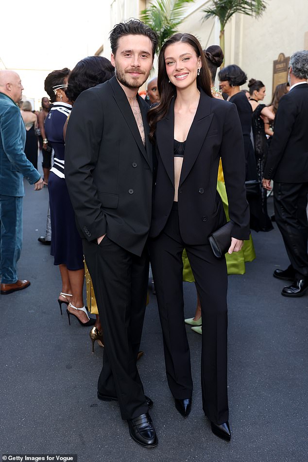 Brooklyn Beckham with wife Nicola Peltz in 2025, amid rumors she ghostwrote his statement.