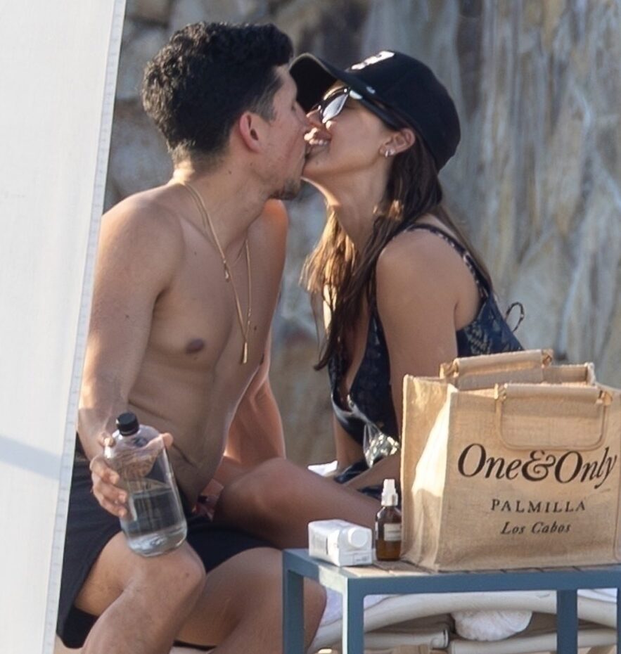 Jessica Alba and Danny Ramirez kissing on a beach in Cabo.