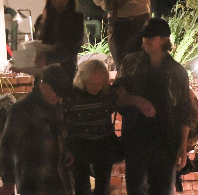 Tippi Hedren, assisted by her daughter Melanie Griffith, leaves a birthday celebration in Los Angeles.