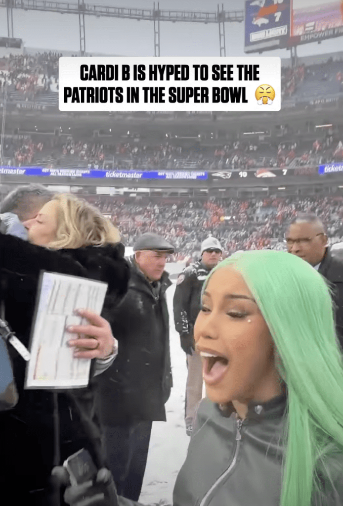 Cardi B reacts on the snowy field, shouting, "We're going to the Super Bowl!"