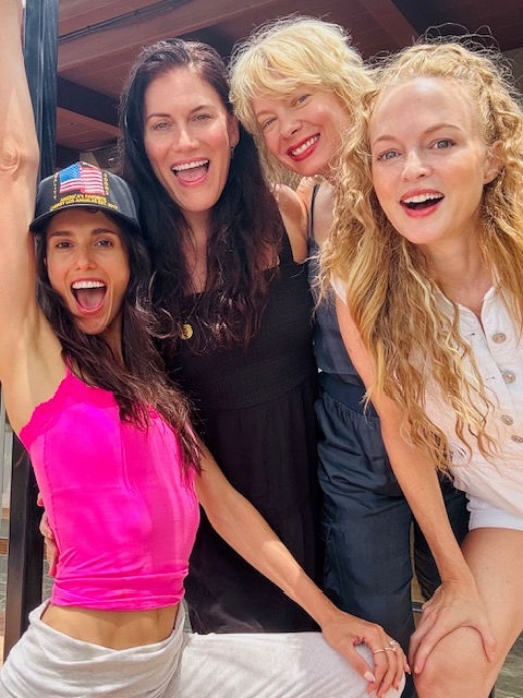 Heather Graham with Debra J. Fisher, Nina Bergman, and Liz Plank smiling for a group selfie.