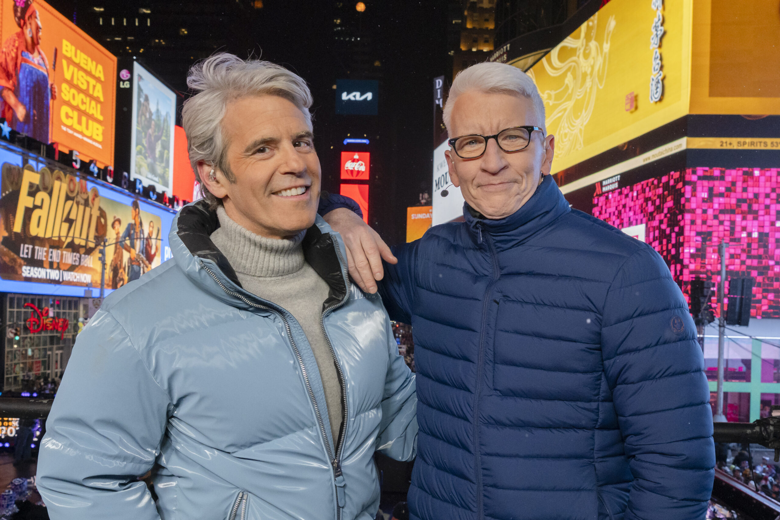 Andy Cohen and Anderson Cooper co-host CNN's New Year's Eve Live in Times Square as social media speculates about Cohen's look.