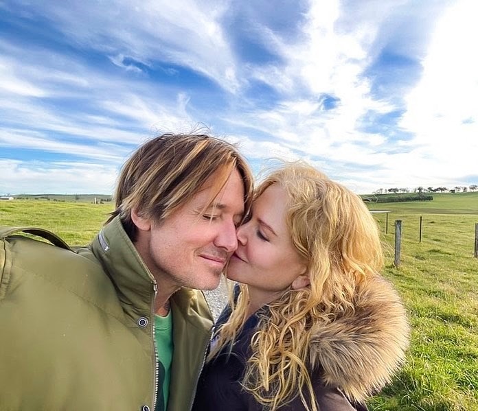 Nicole Kidman kisses Keith Urban on the cheek in an Instagram photo.