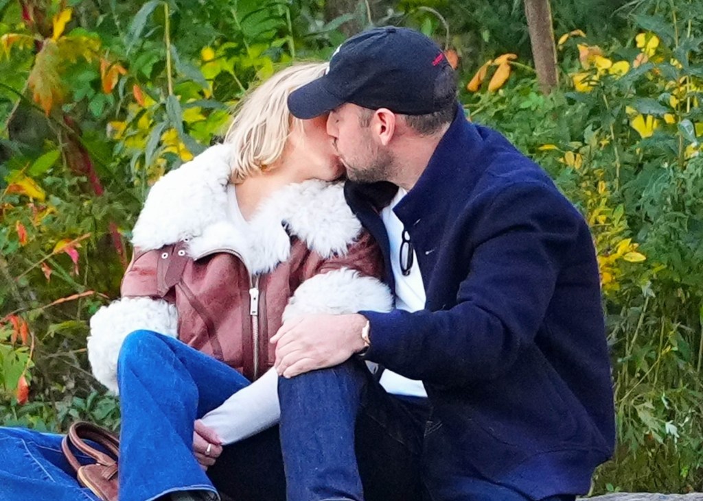Sydney Sweeney and Scooter Braun kissing during a romantic outing in Central Park.