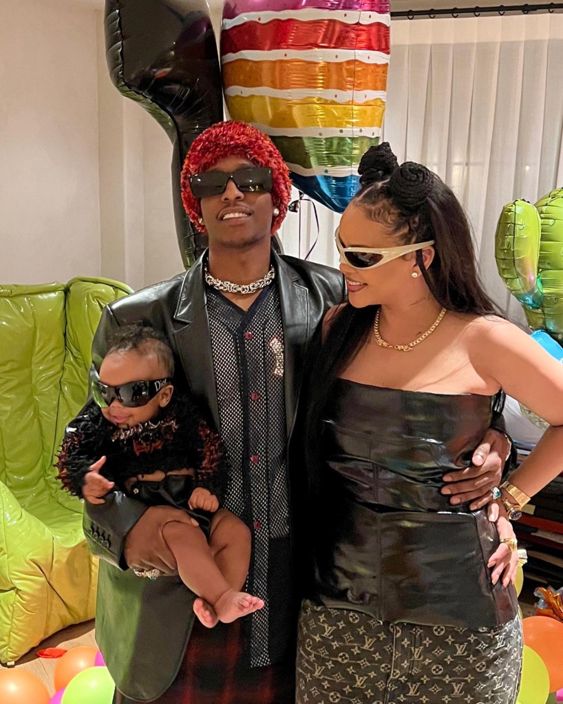 Rihanna, A$AP Rocky, and their baby pose for a family photo.
