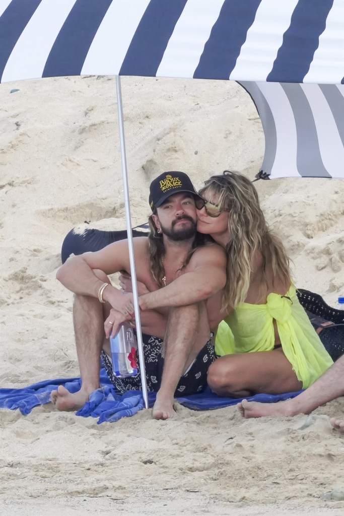 Heidi Klum and Tom Kaulitz relaxing under an umbrella on Saline Beach in St. Barts.