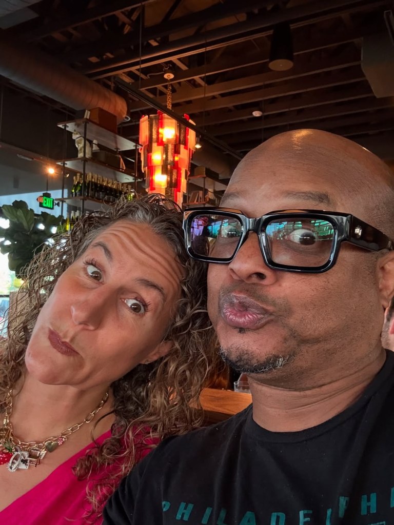 Todd Bridges and Bettijo taking a selfie, making funny faces.