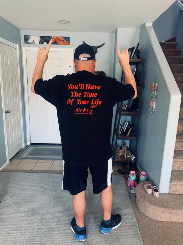 Sean Swayze wearing a black T-shirt that says "You'll Have The Time Of Your Life" in red letters.