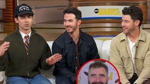 The Jonas Brothers performing together onstage