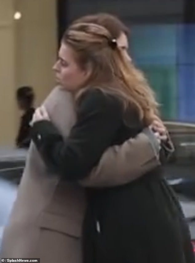 Princess Beatrice and Princess Eugenie embrace, presenting a united front