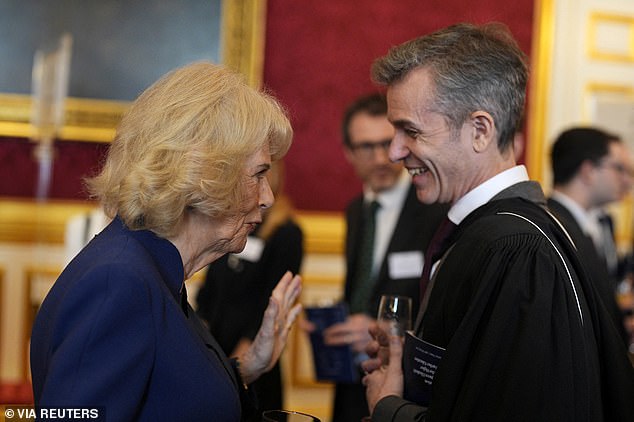 Queen Camilla speaks with a guest during the post-ceremony reception at St James's Palace