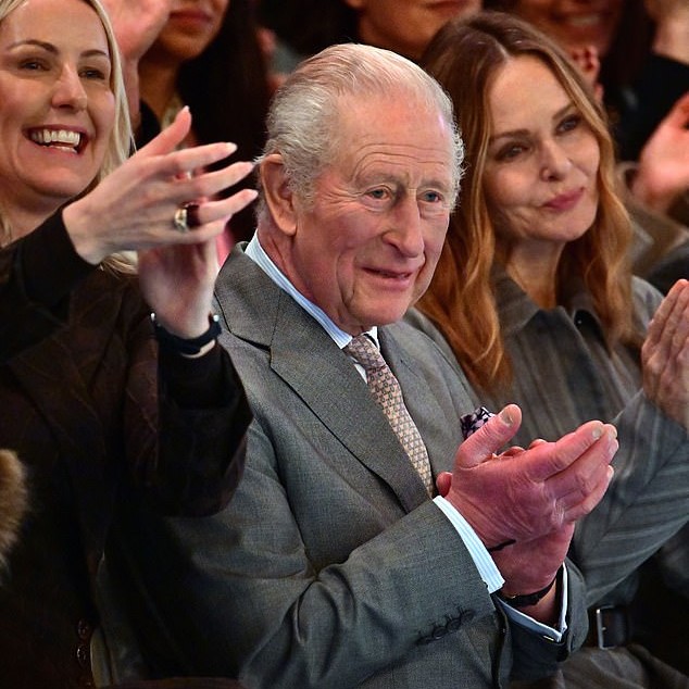 As the disgraced Andrew languished in a cell and was interviewed by detectives, the royal family soldiered on with business as usual, the King appeared at London Fashion Week. Pictured: Charles, on the front row at Tolu Coker's show, with designer Stella McCartney, right - Daily Mail US