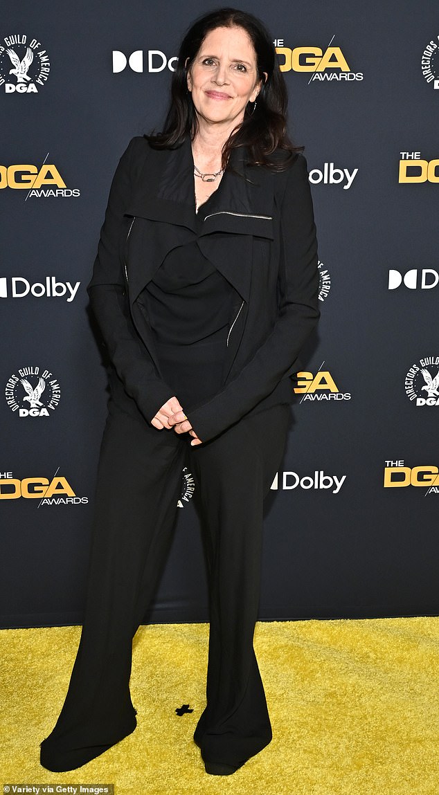Laura Poitras at the 2026 DGA Awards in black flared pants with a simple top and jacket