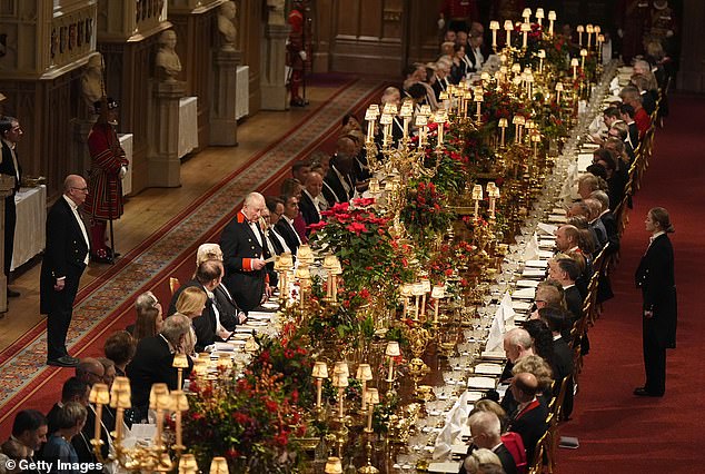 King Charles raises a toast at a formal state banquet