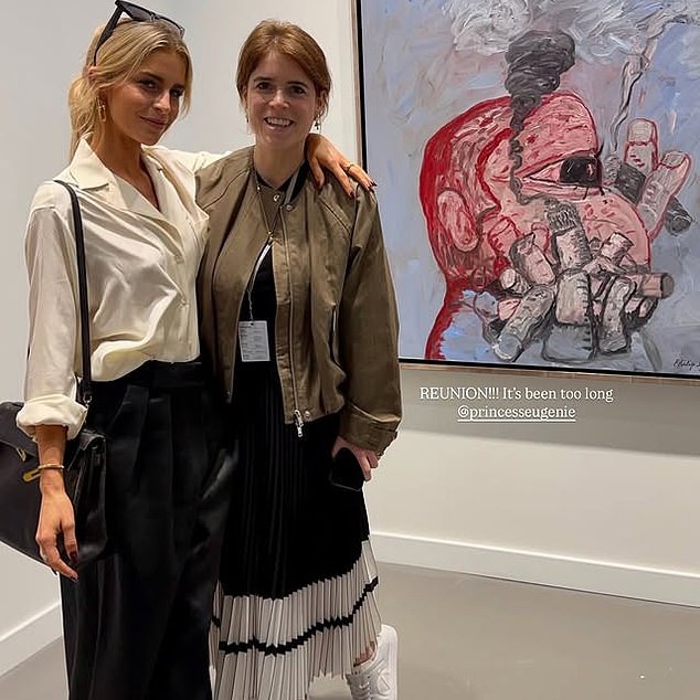 Eugenie is pictured with friend Caroline Daur, 30, working at an art fair in Qatar this week - DailyMailUS