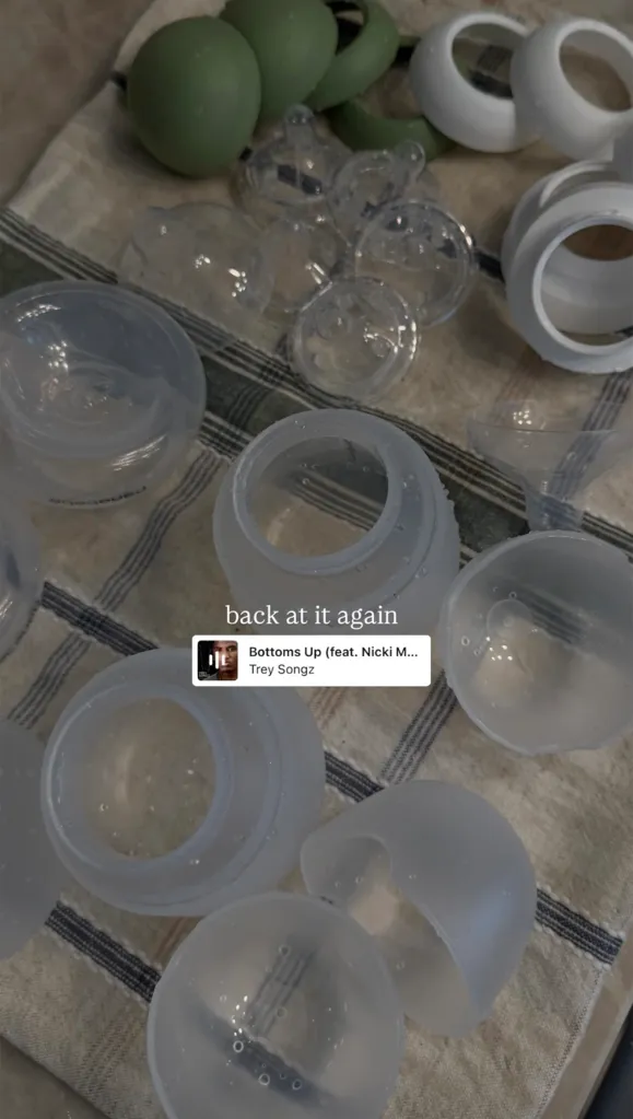 Baby bottle parts drying on a striped towel, as shared on Nicole Combs' Instagram.