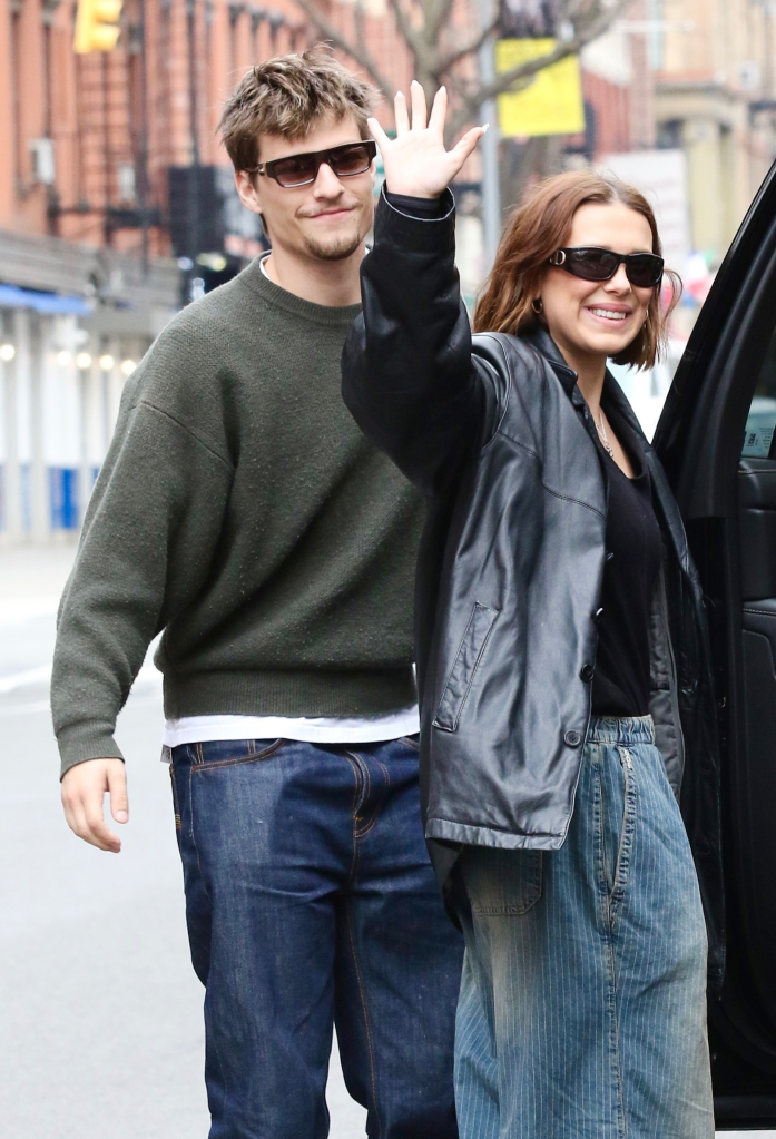 Millie Bobby Brown smiles and waves alongside husband Jake Bongiovi in New York City on her 22nd birthday.