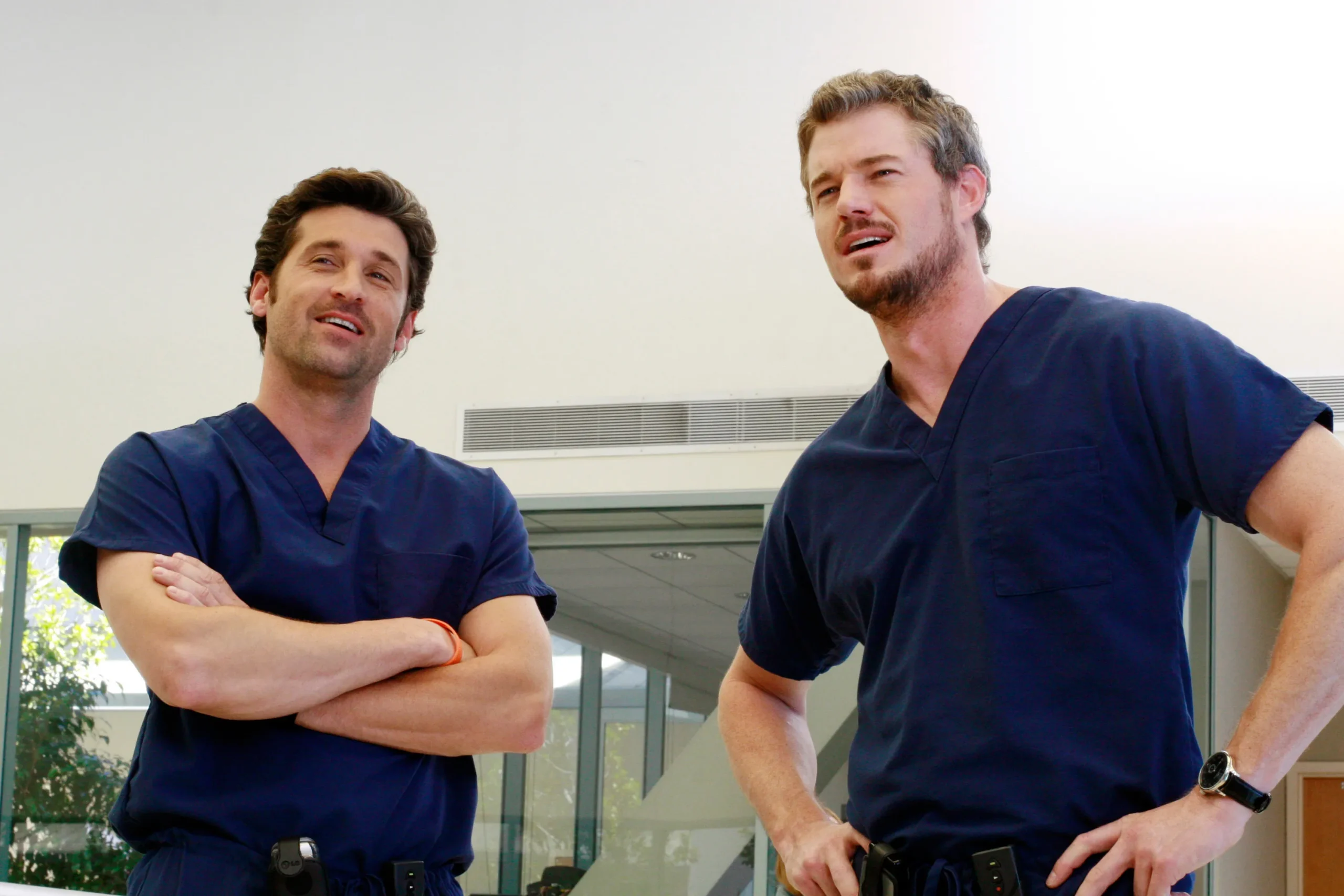 Patrick Dempsey and Eric Dane as doctors in scrubs on Grey's Anatomy.