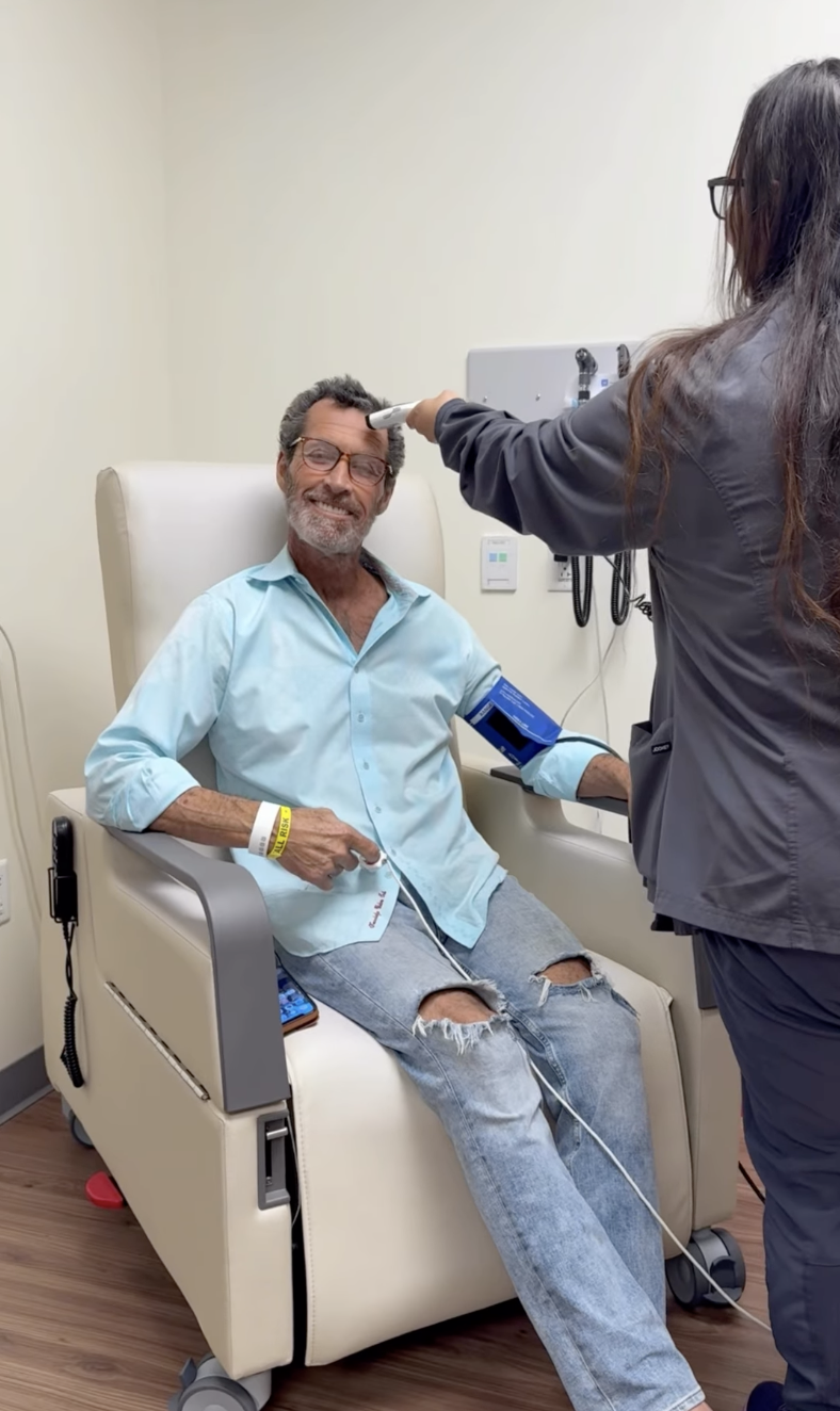 Ron Duguay seated in a treatment chair during cancer care