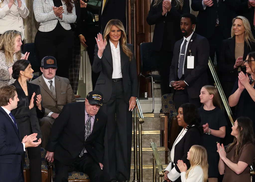 Melania Trump waves to guests from the House gallery during the State of the Union.