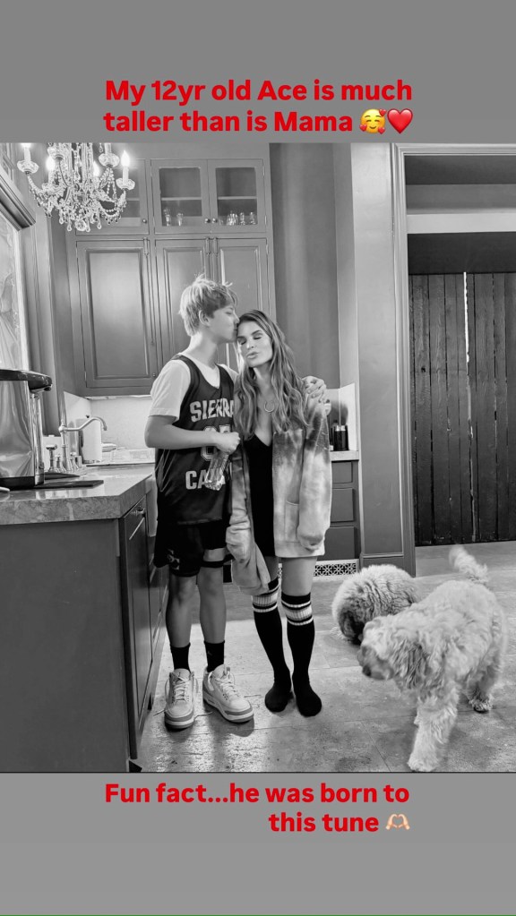 The "I Wanna Love You Forever" hitmaker posted a sweet photo of her son towering over her as he planted a kiss on her head. - pagesix