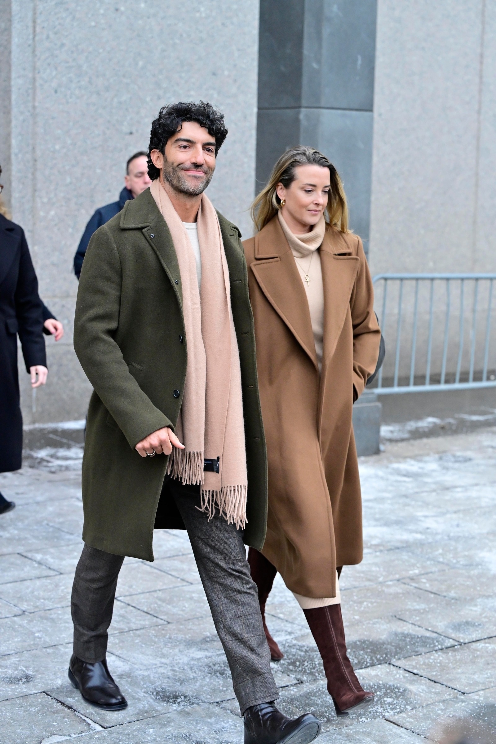 Justin Baldoni walking outside the Manhattan courthouse with a companion following settlement talks.