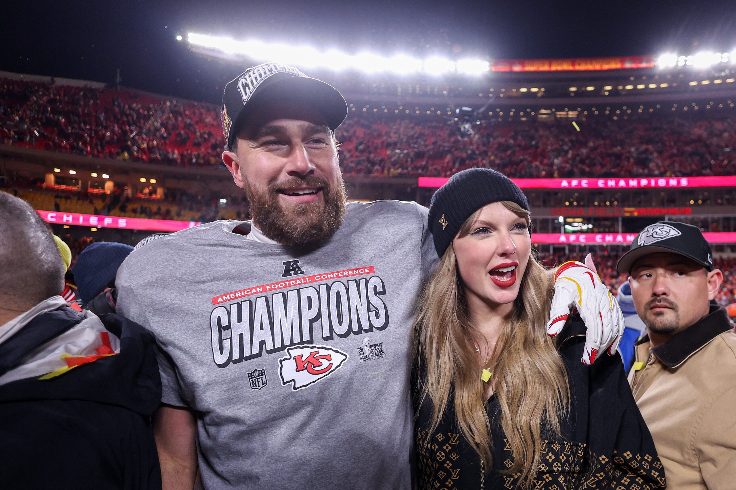 Travis Kelce and Taylor Swift celebrate together after a victory.