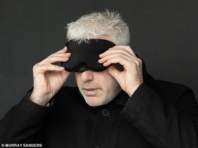 MacIntyre adjusting an eye mask before entering the blackout cabin.