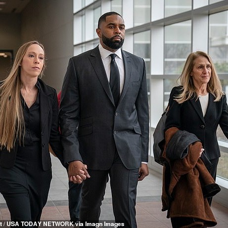 Kelli Moore, left, walks with her husband former University of Michigan football coach Sherrone Moore, with his attorney Ellen Michaels on Friday in Ann Arbor - Daily Mail
