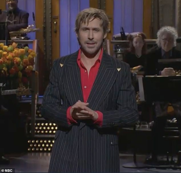 A camera operator wearing an 'I heart Harry' shirt is revealed during the SNL monologue bit.