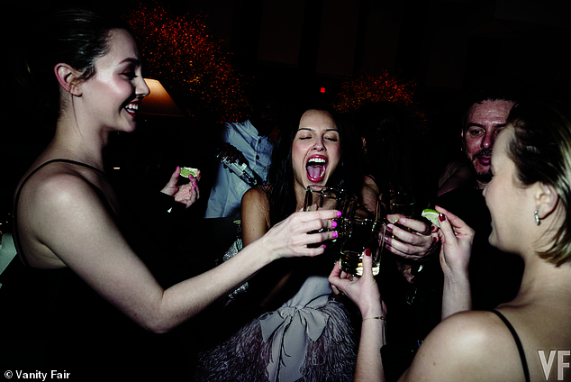 Circulating image reportedly showing Olivia Rodrigo clinking glasses and taking a tequila shot inside the Vanity Fair Oscars party.