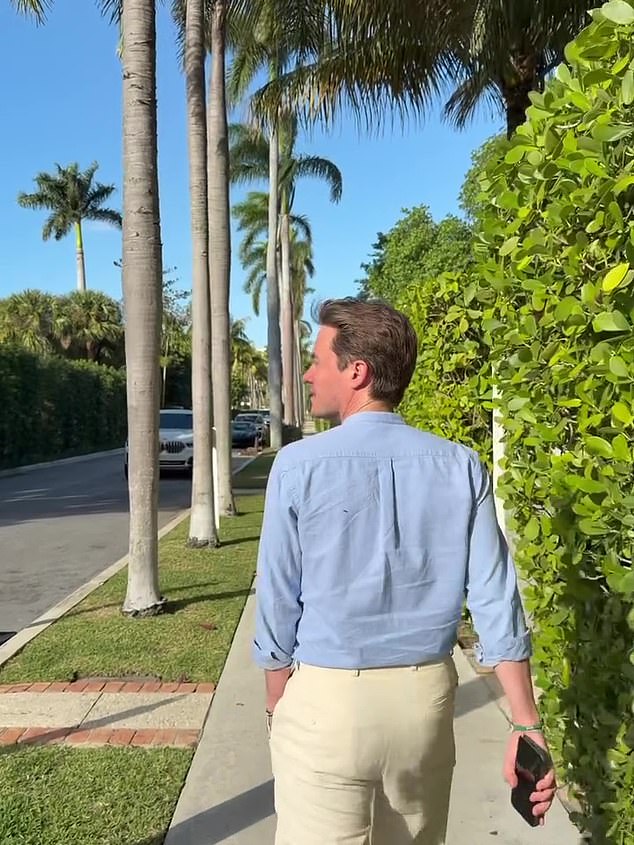 Edoardo Mapelli Mozzi strolling a tree-lined street in Palm Beach during the same trip.