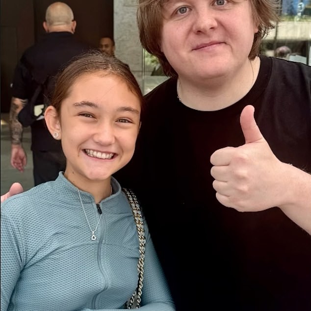 Jude Law's ex thanked Lewis Capaldi for his 'kindness' after he posed for a snap with the actor's daughter on Sunday, following her upsetting run-in with Chappell Roan - Daily Mail US