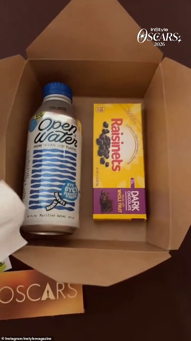 Oscars snack box with water, SkinnyPop popcorn, and dark-chocolate Raisinets handed to attendees inside the Dolby Theatre.