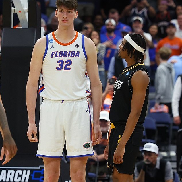 The 7ft 9in basketball star went viral after making his March Madness debut for Florida - Daily Mail US